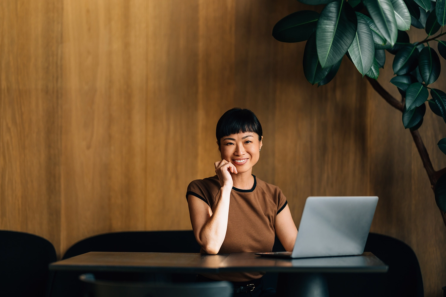 Asian lady working in Marketing Procurement smiling to camera