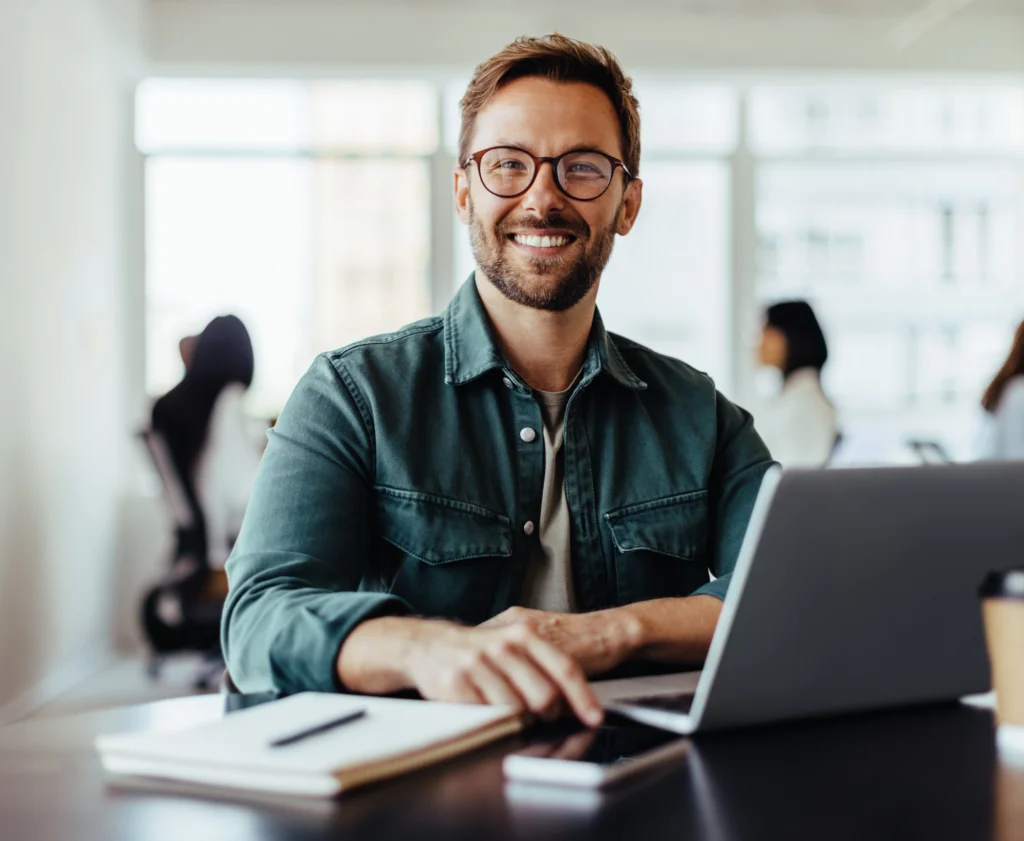 A Marketing Procurement professional analysing procurement data on his laptop using RightSpend