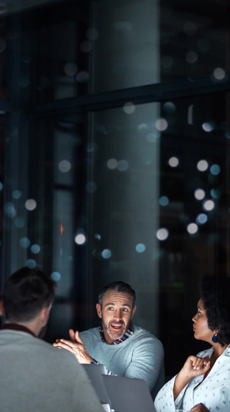 Marketing Procurement team discussing benchmarking fees for better ROI