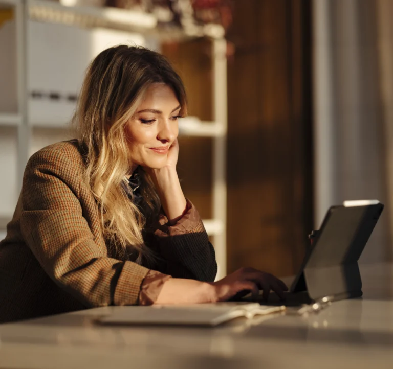 CMO looking at a laptop with RightSpend's Marketing Procurement data on