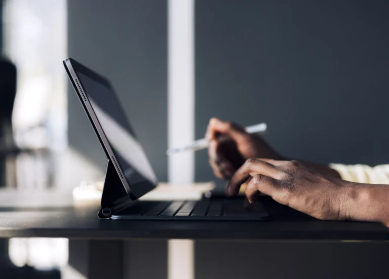 Close up of hands on a laptop using the RightSpend Marketing Procurement solution