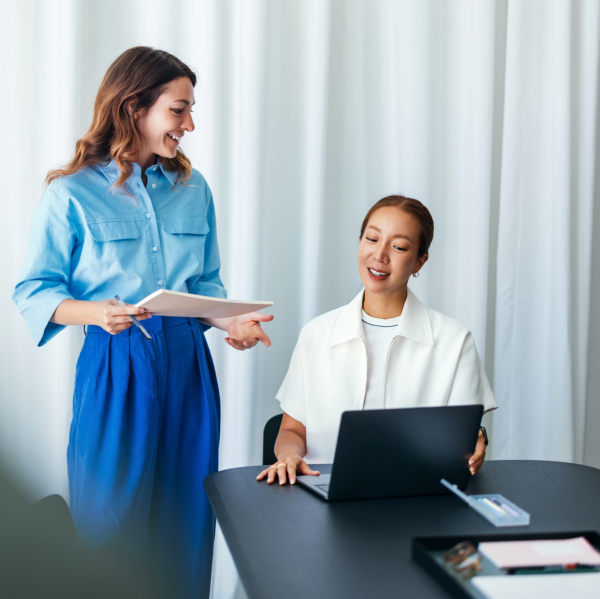 Marketing colleagues discussing using RightSpend system