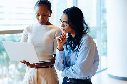 Two Marketing Procurement professionals looking at cutting the waste not the cost